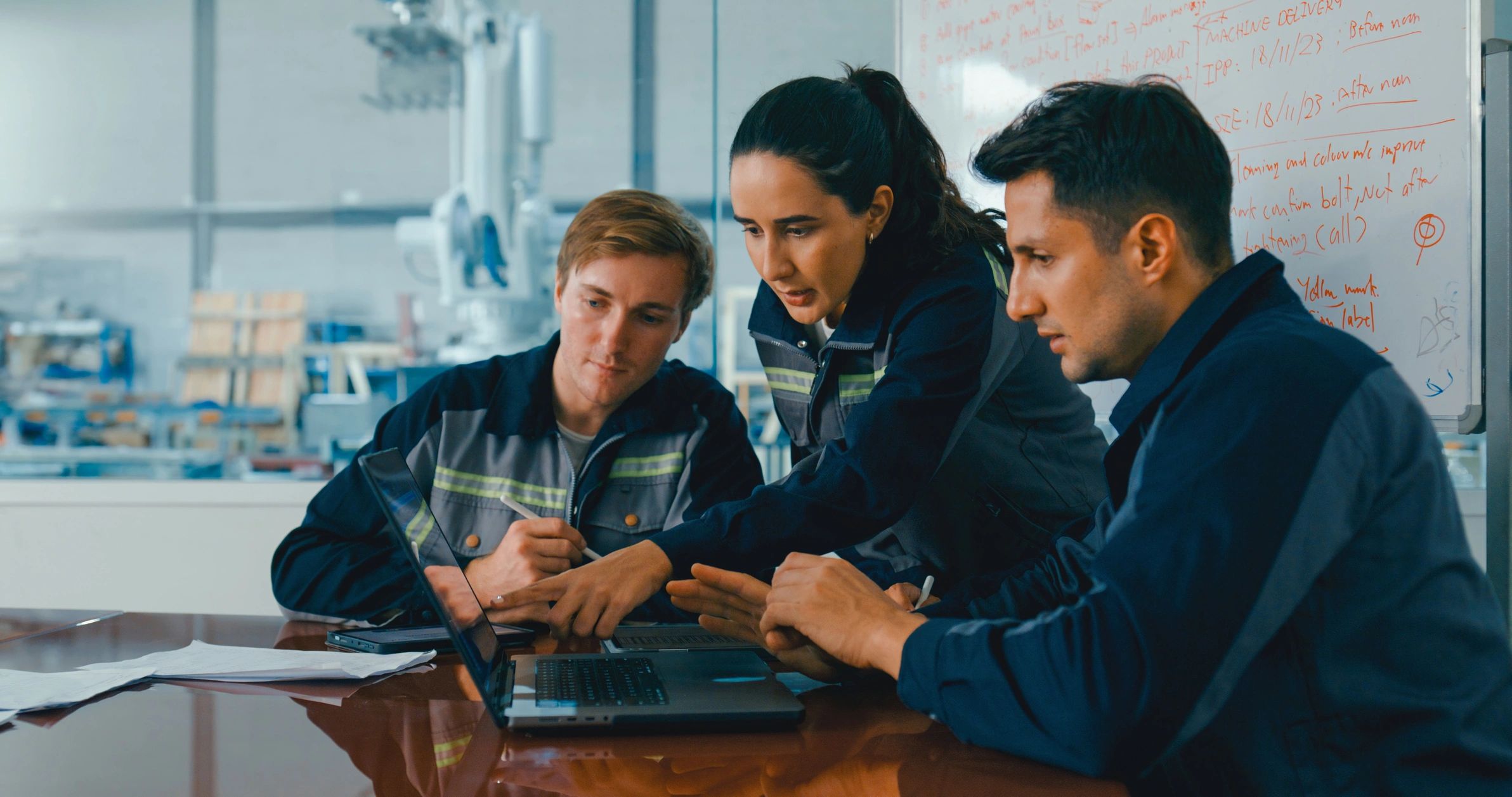 Women engineers collaborating in factory